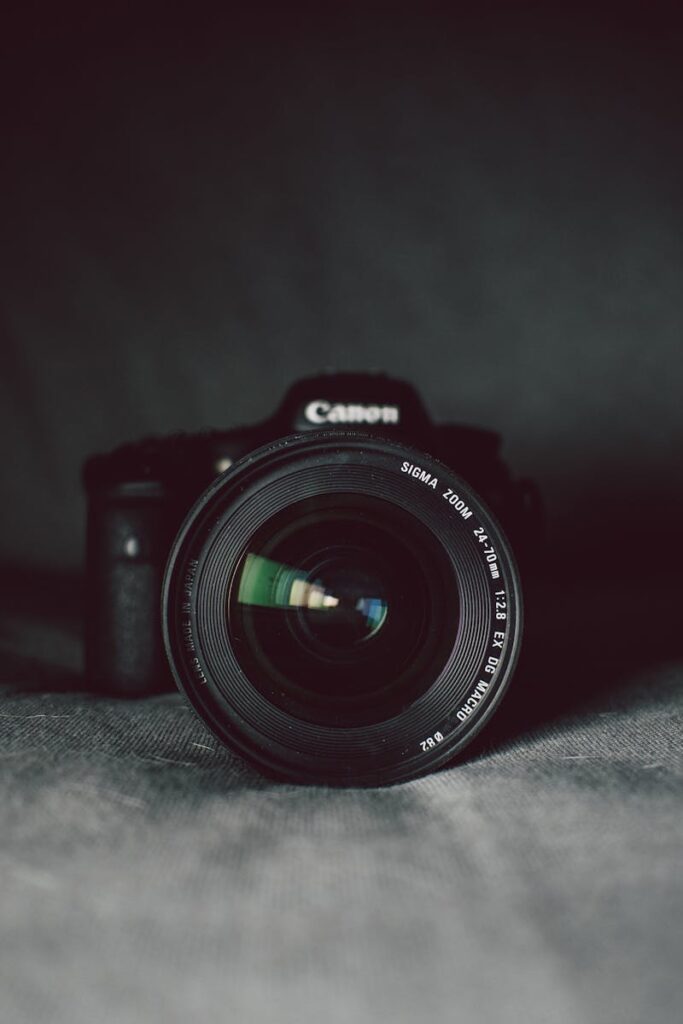 pexels-photo-274973-274973 A camera lens in focus against a dark background, highlighting the optical details.